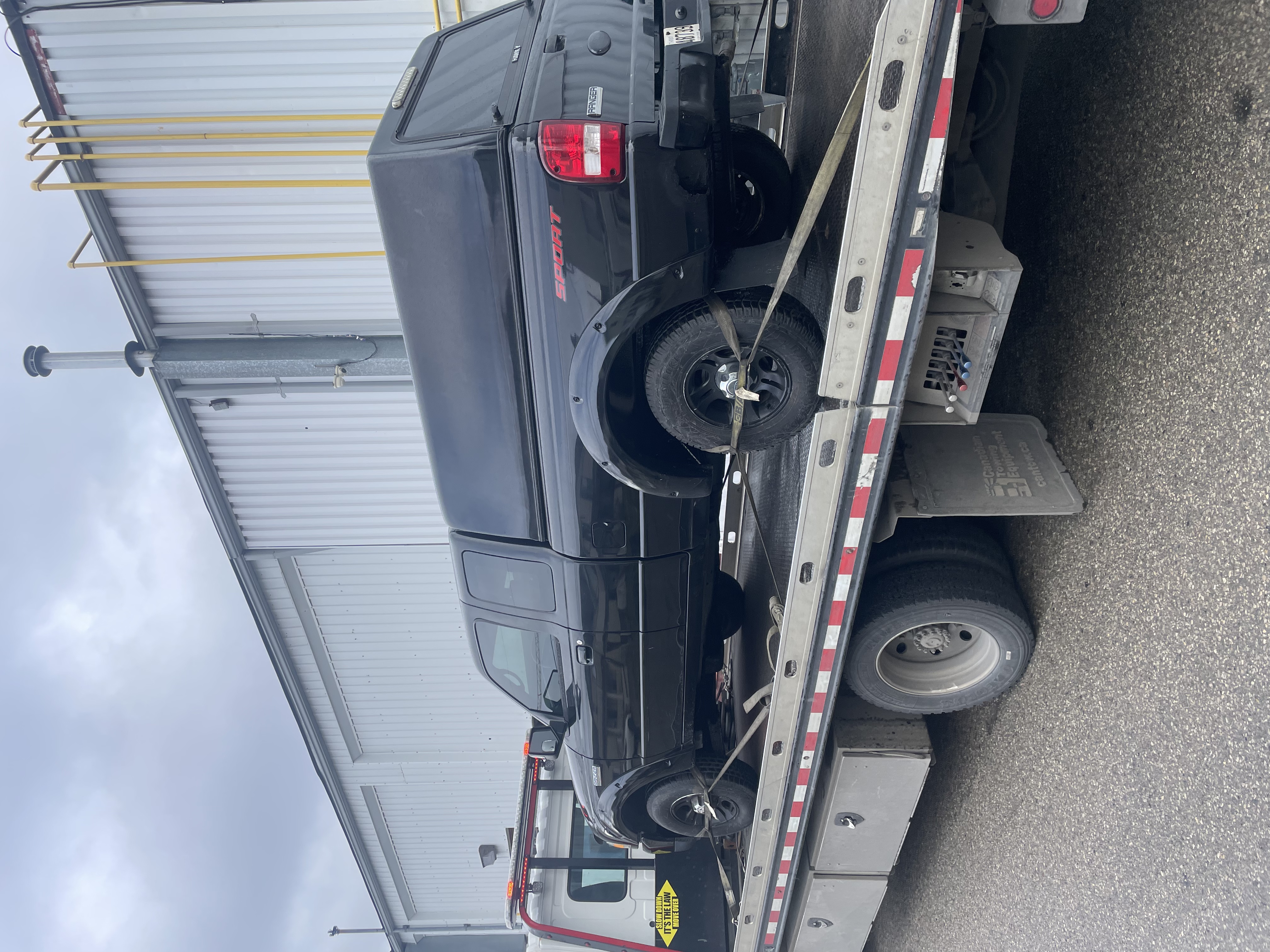 Scrappy Car tow truck picking up junk car in Scarborough